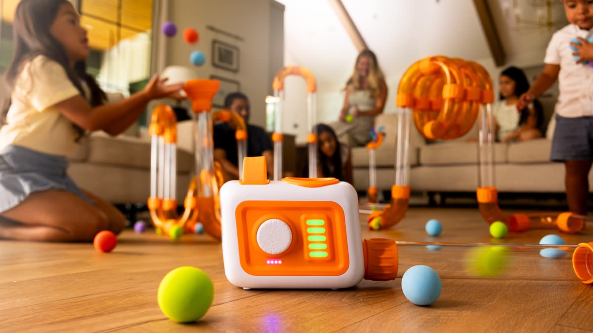 Family indoors playing with Air Toobz Evo