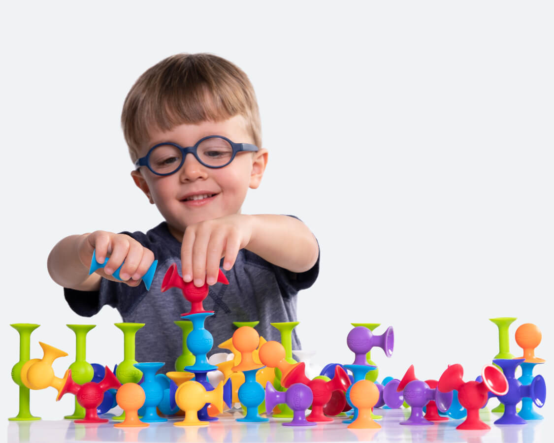 Child having fun playing with Squigz